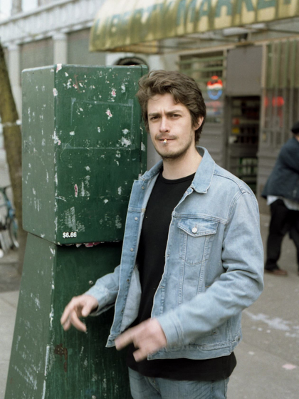 Derrick smoking outside on a Vancouver strees